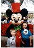 DANIEL (on the right ) with Mickey in Disneyland