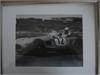 Framed B/W photo signed by Sir Stirling Moss