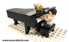 LEGO rock legends figure of Freddie Mercury at ths Steinway for Live Aid